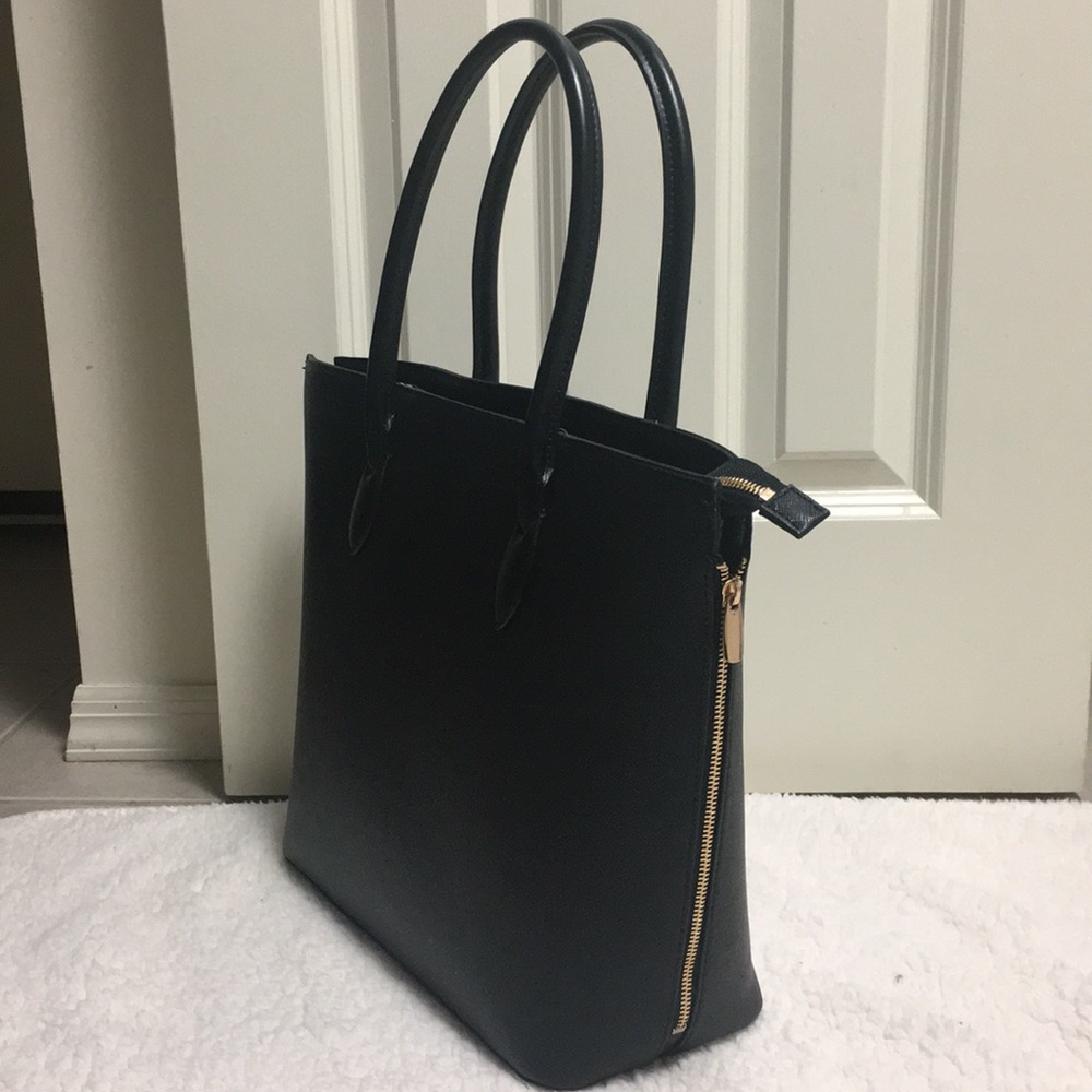 Never used. Black vinyl tote bag
